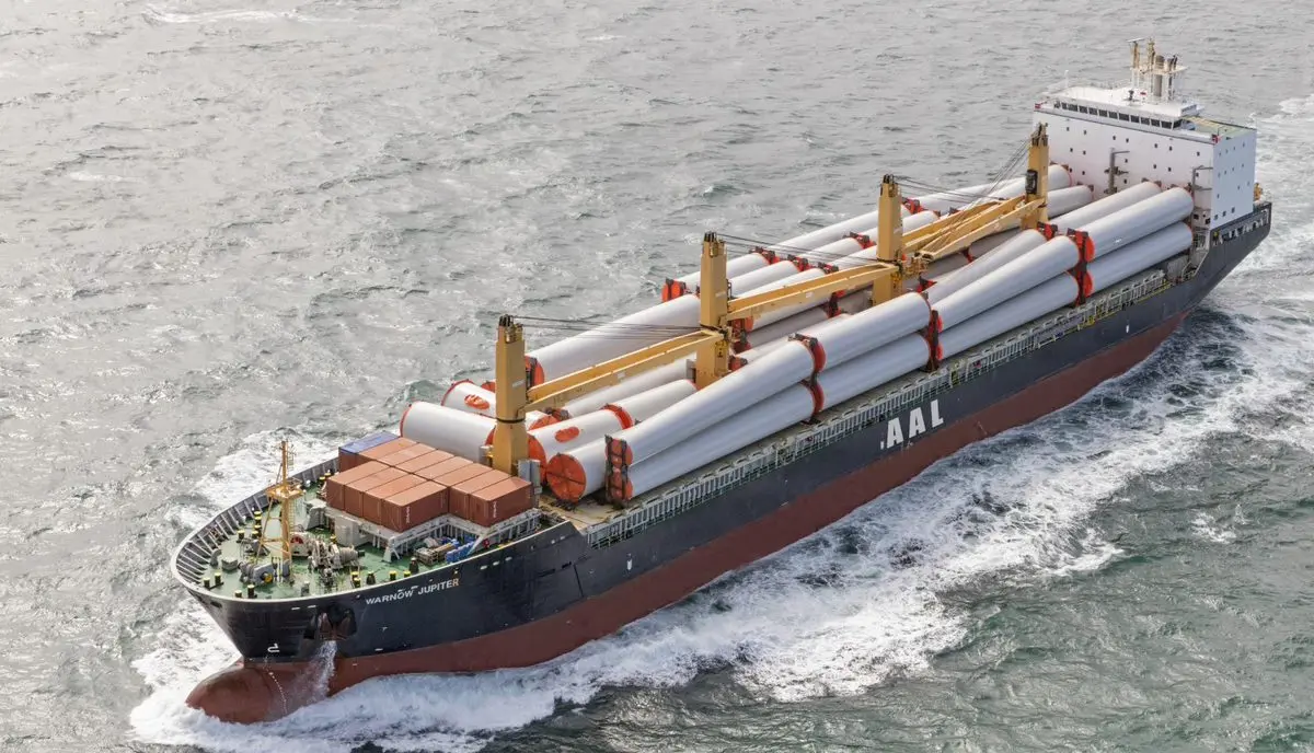 Industrial crane loading heavy cargo on a vessel